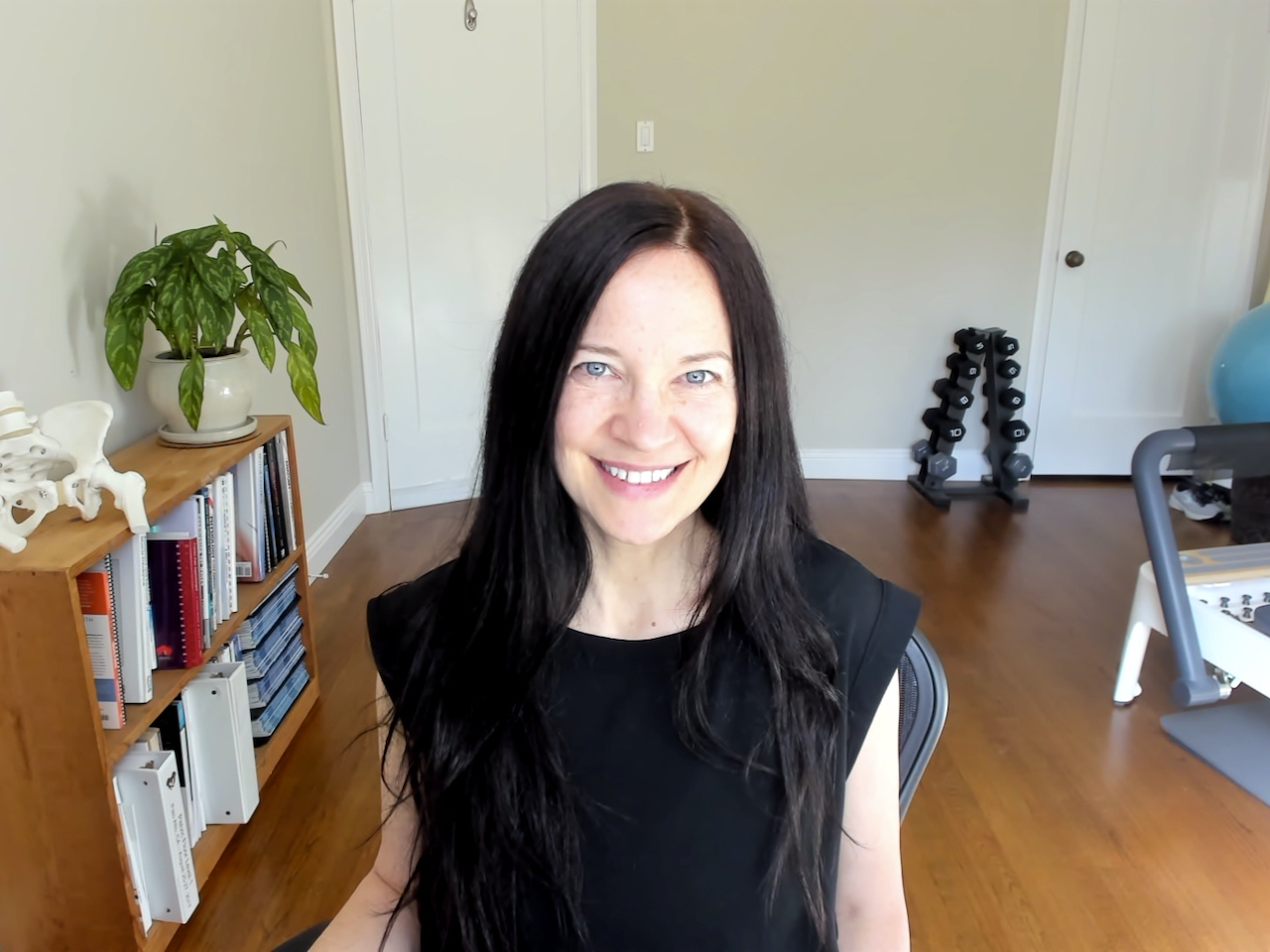 Woman sitting in office chair and smiling
